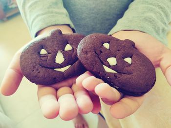 Close-up of hand holding cookies