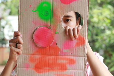 Close-up portrait of a girl holding hands