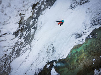 High angle view of person on snowcapped mountain