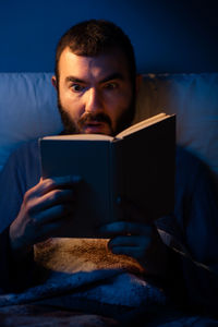 Portrait of young man using mobile phone