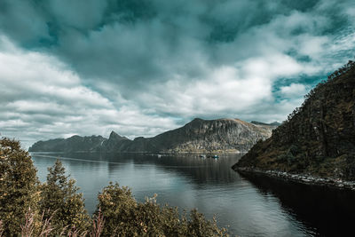 Scenic view of lake and mountains against sky