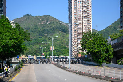 Road by city against clear sky