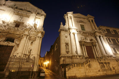 Low angle view of illuminated building at night