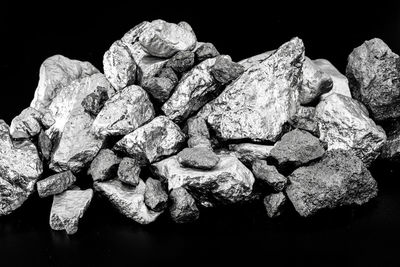 Close-up of rocks against black background