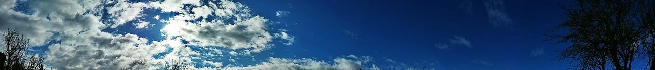 Scenic view of mountains against blue sky