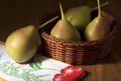 Close-up of fruits in basket on table