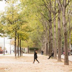 Full length of people walking on footpath
