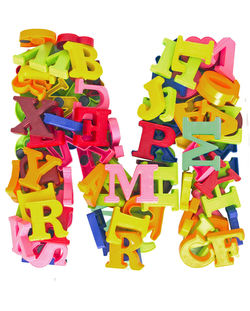 Close-up of multi colored toys over white background