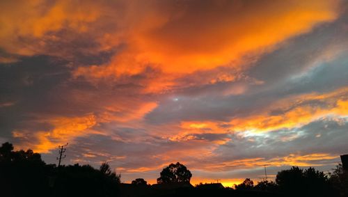 Low angle view of dramatic sky at sunset