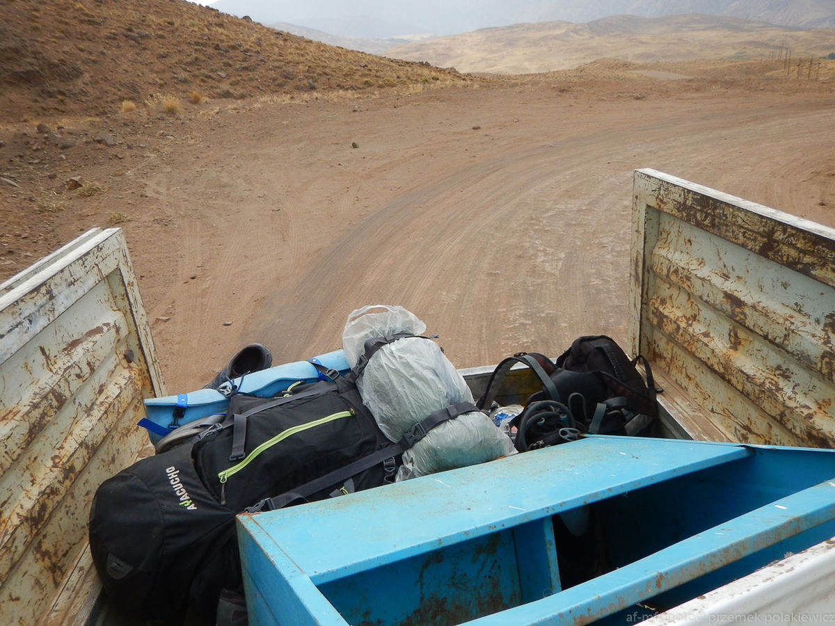 REAR VIEW OF MEN ON VEHICLE