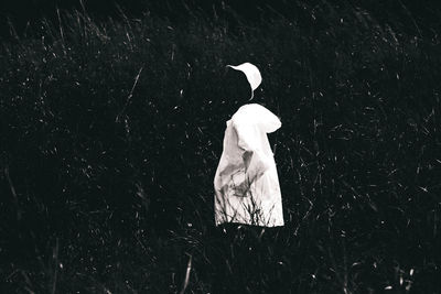 Ghost against plants in forest