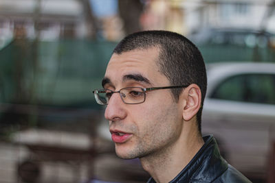 Portrait of young man looking away