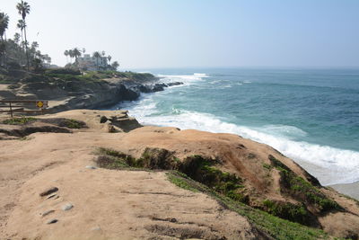 Scenic view of beach against clear sky