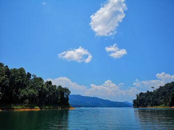 Scenic view of lake against blue sky