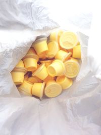 High angle view of yellow eggs on bed