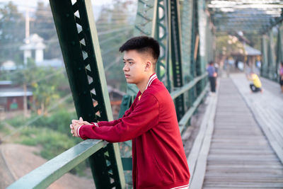 Side view of young man looking away