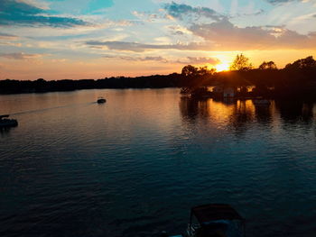 Scenic view of lake against sky during sunset