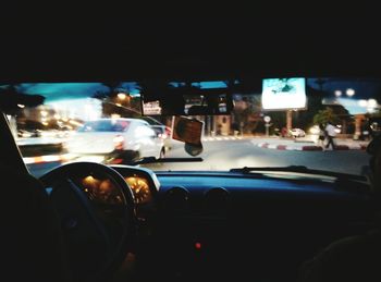 Woman driving car on road