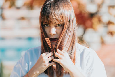 Portrait of young woman looking away