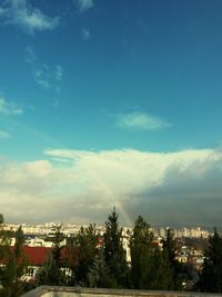 Cityscape against cloudy sky