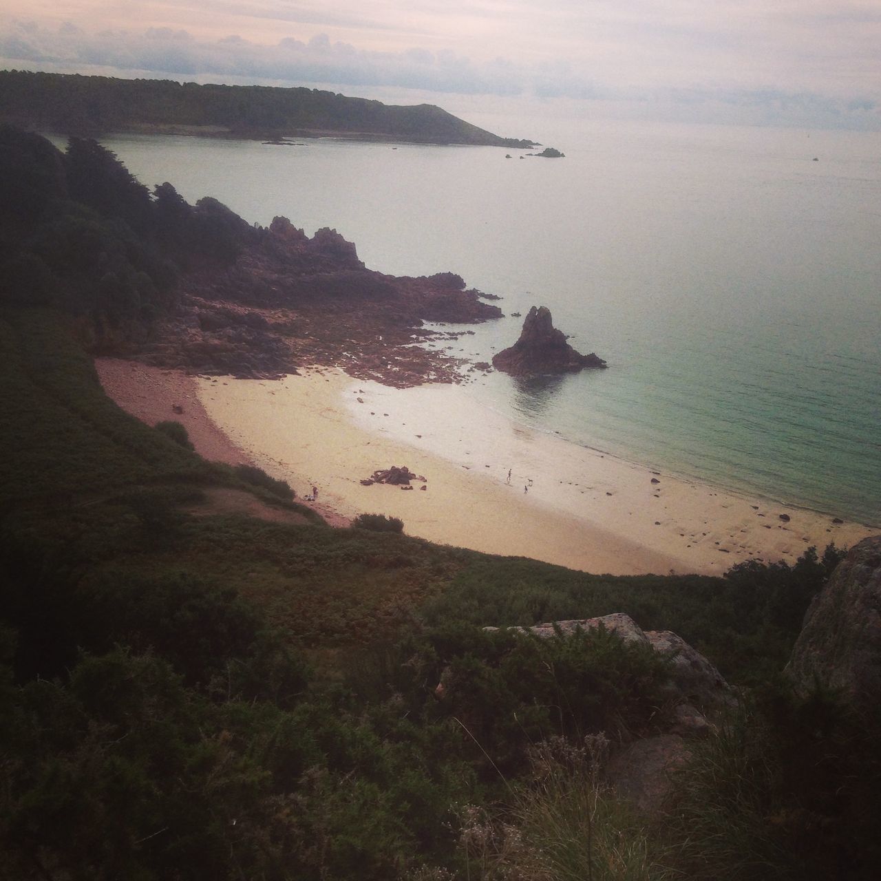 sea, water, tranquil scene, horizon over water, tranquility, beach, scenics, beauty in nature, shore, high angle view, coastline, nature, idyllic, sky, rock - object, sand, calm, rock formation, ocean, cliff