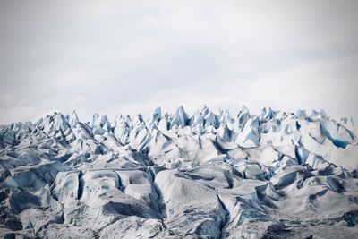 Scenic view of snowcapped landscape against sky