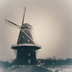 Traditional windmill against sky