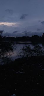 Scenic view of lake against sky at sunset