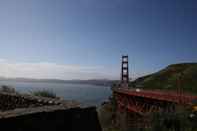 Bridge over bay against sky