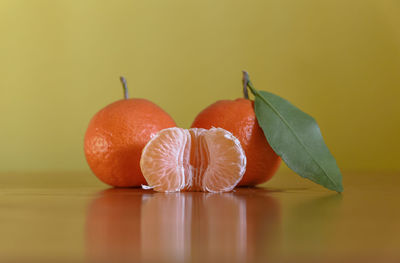 Close-up of orange fruit on table