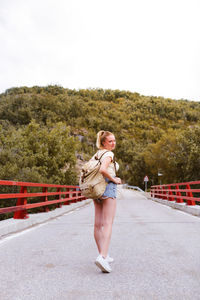 Woman walking on road