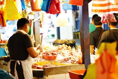 People at market stall