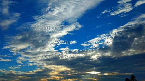 Low angle view of blue sky and clouds