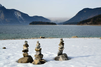 Rock stacks by walchensee lake during winter