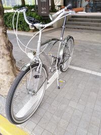 Bicycle parked on footpath in city