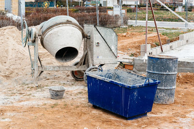 Containers and machinery at construction site