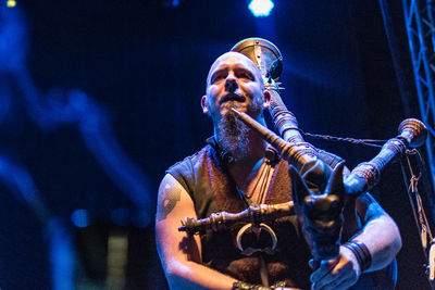 Man playing at music concert