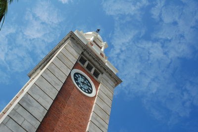 Low angle view of clock tower against sky