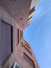 Low angle view of historic building against blue sky