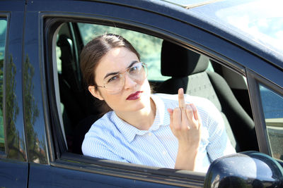 Portrait of woman sitting in car