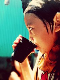 Close-up portrait of a man drinking water