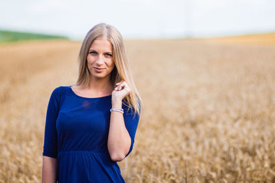 Young woman standing in a field