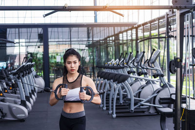 Young woman exercising in gym