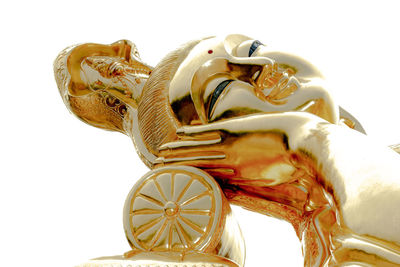 Close-up of horse cart against white background