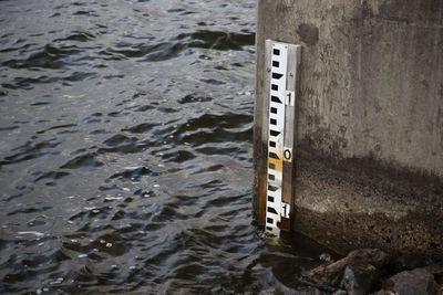High angle view of text on sea shore