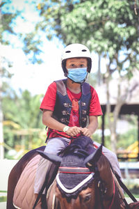 Full length of man riding motorcycle