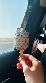 Cropped hand of person holding ice cream