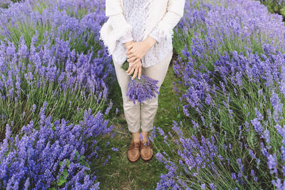 Close-up of woman holding flowers