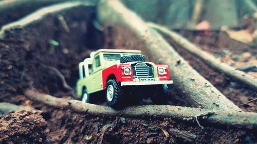 Close-up of toy car on rock