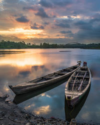 Scenic view of lake against sky during sunset